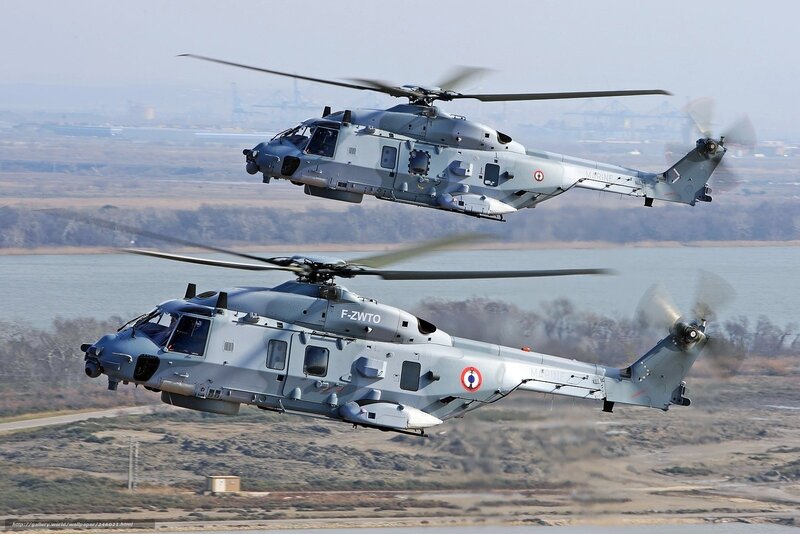 Two military helicopters in flight