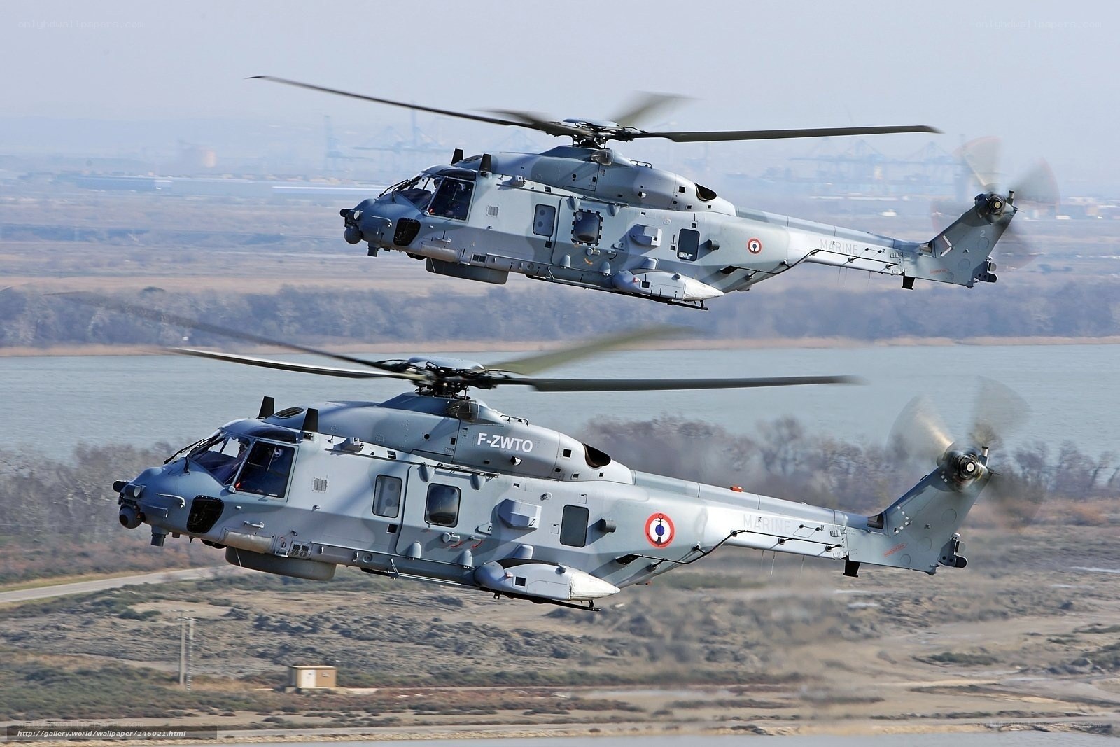 Two military helicopters in flight