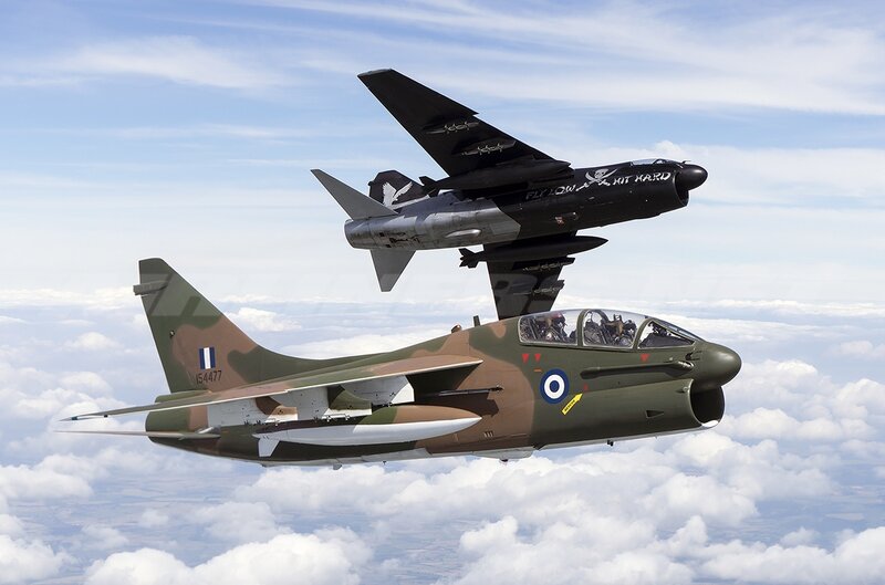Two Military Jets in Flight — Green, Dynamic, Afternoon