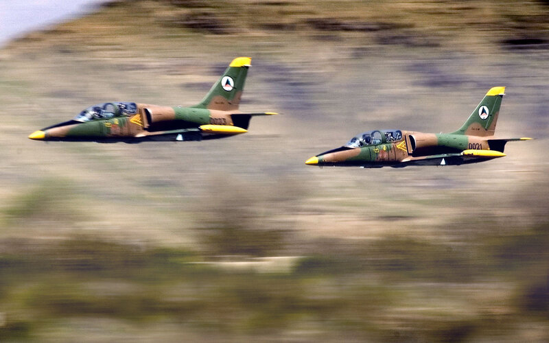 Two Military Jets in Flight — Green, Dynamic, Photograph