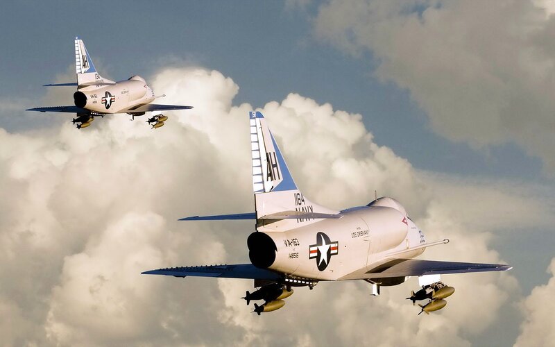 Two Military Jets in Flight — White
