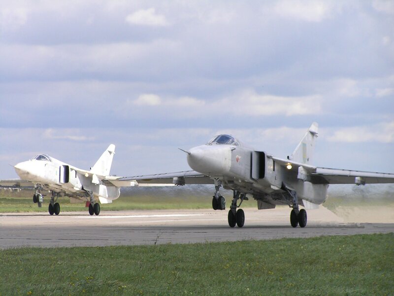 Two military jets on runway