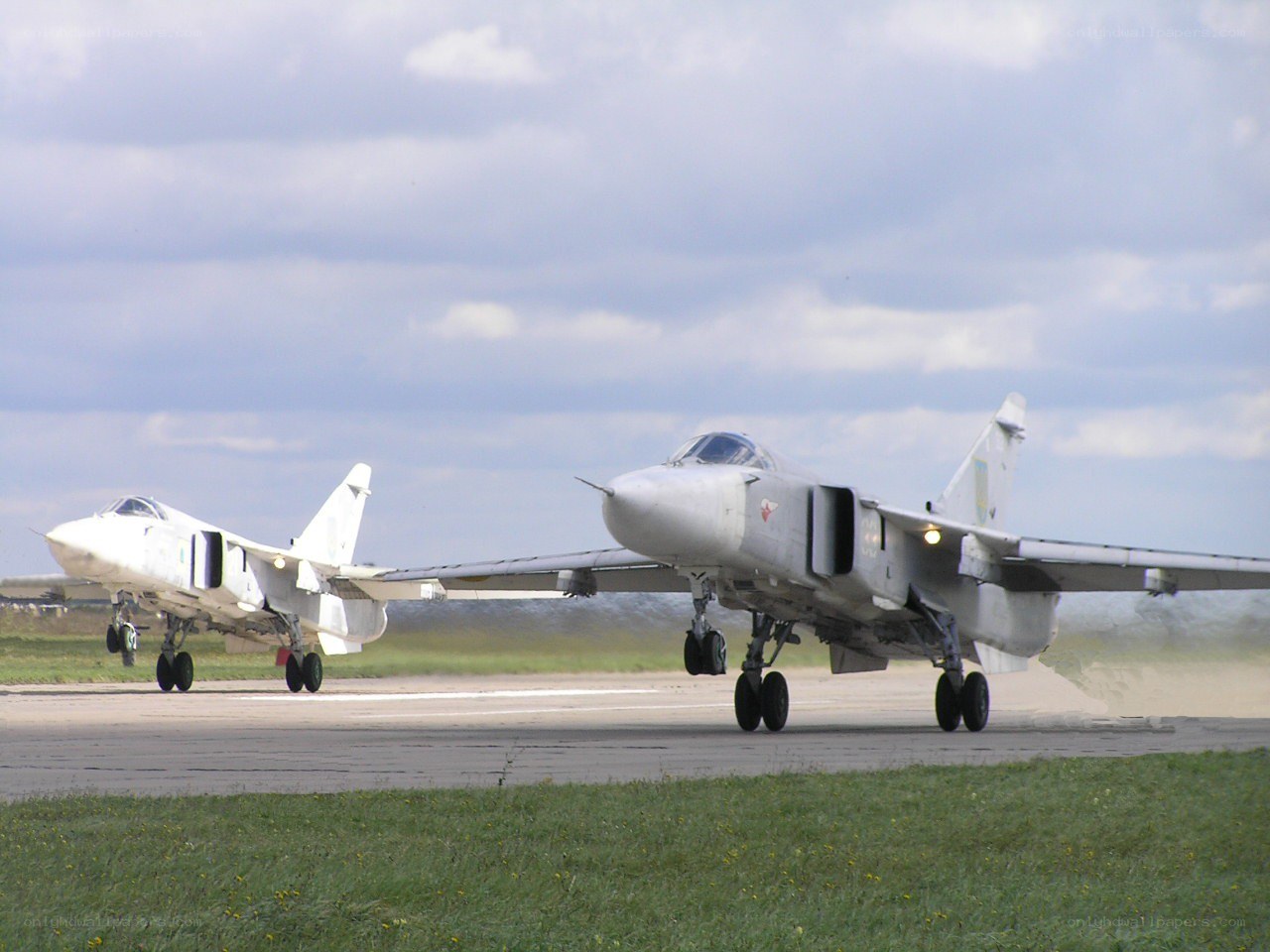 Two military jets on runway