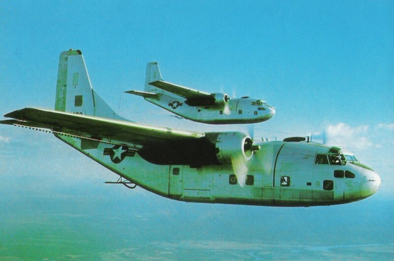 Two military transport planes in flight