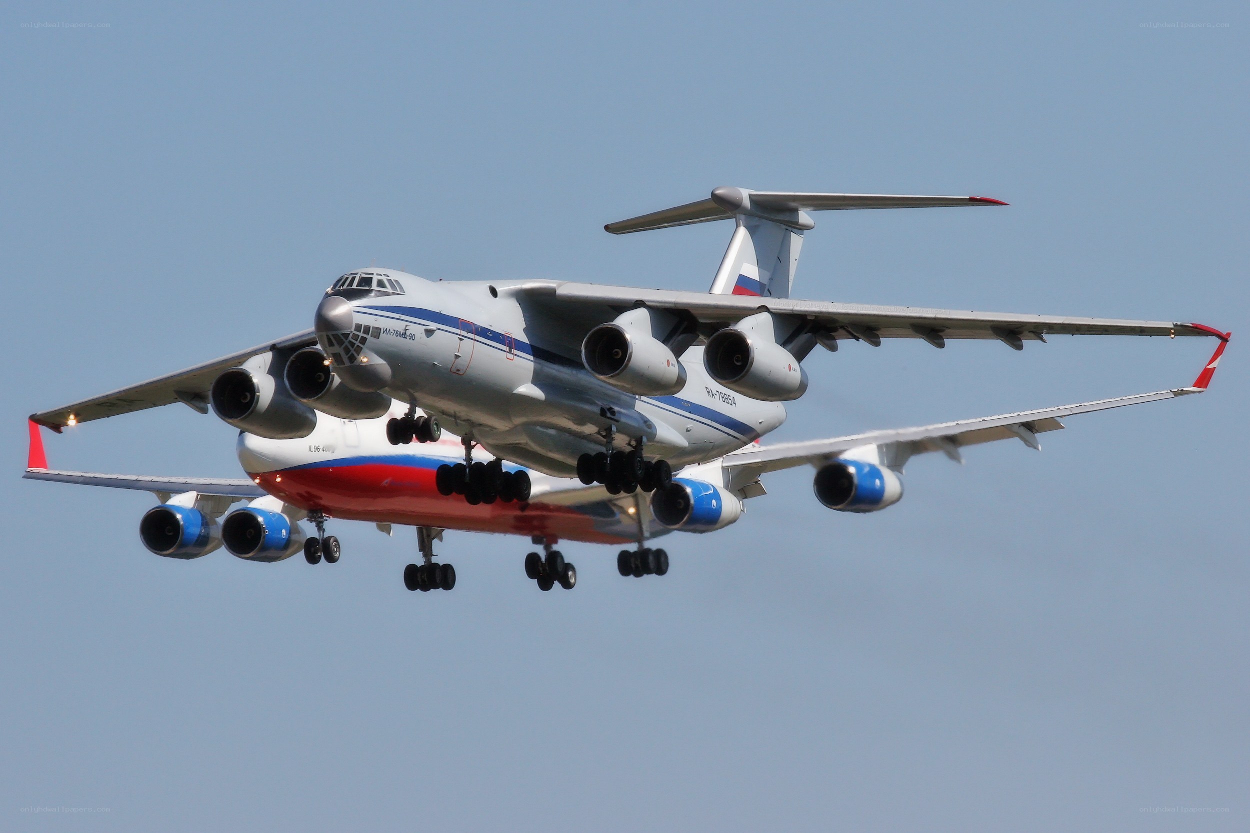 Two military transport planes in flight