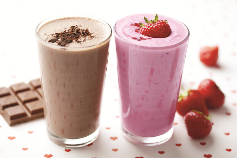 Two Milkshakes in Glasses