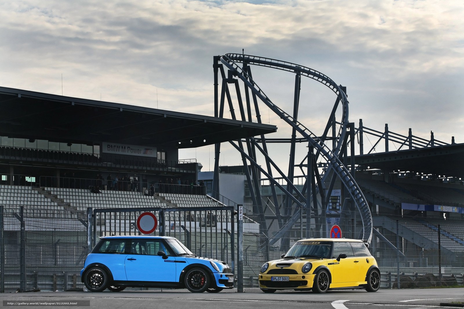 Two MINI cars at a racetrack