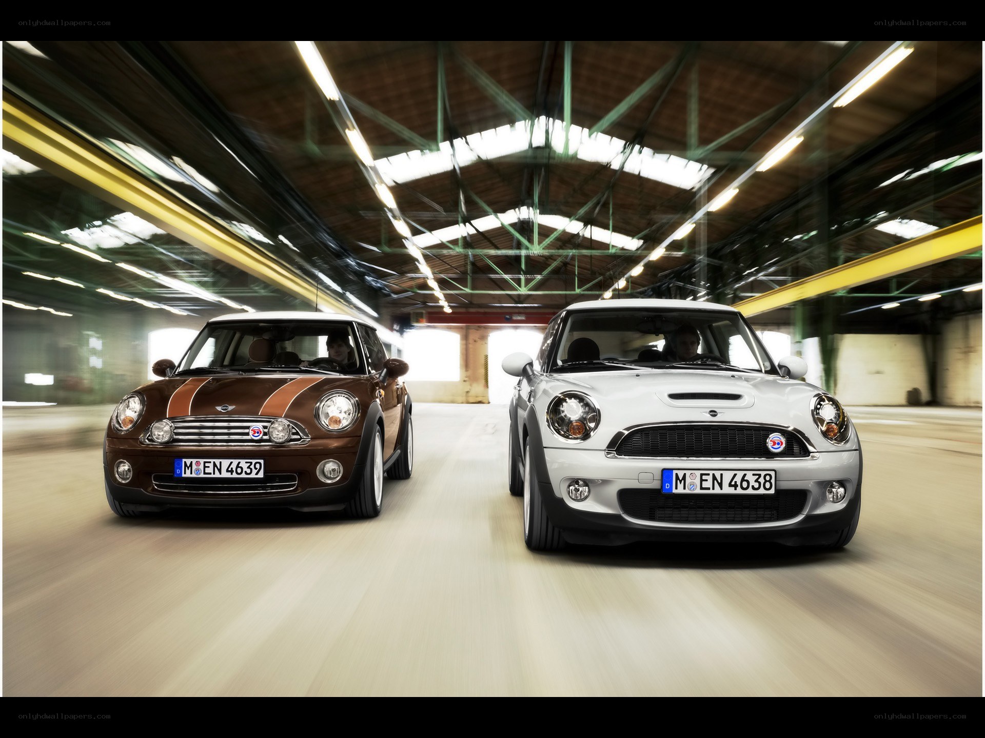 Two MINI Coopers in motion