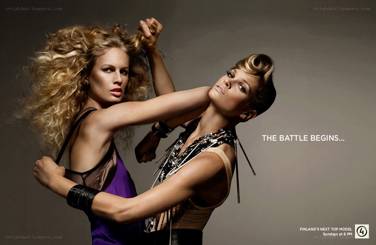 Two models in a battle pose