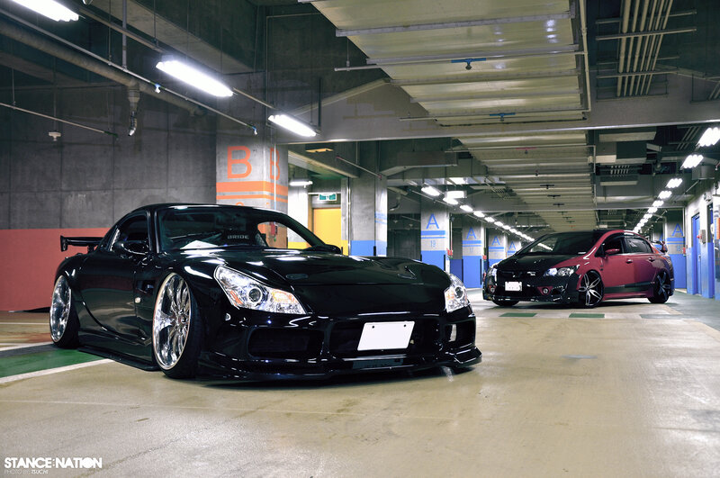 Two Modified Cars in Garage