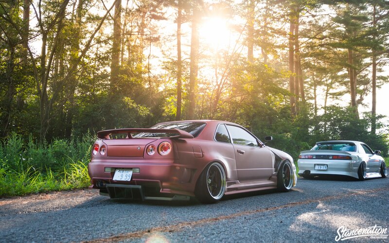 Two Modified Cars on Road