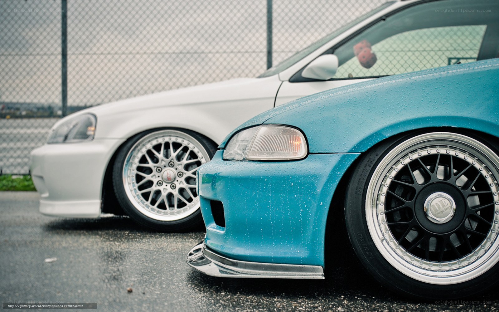 Two modified cars parked