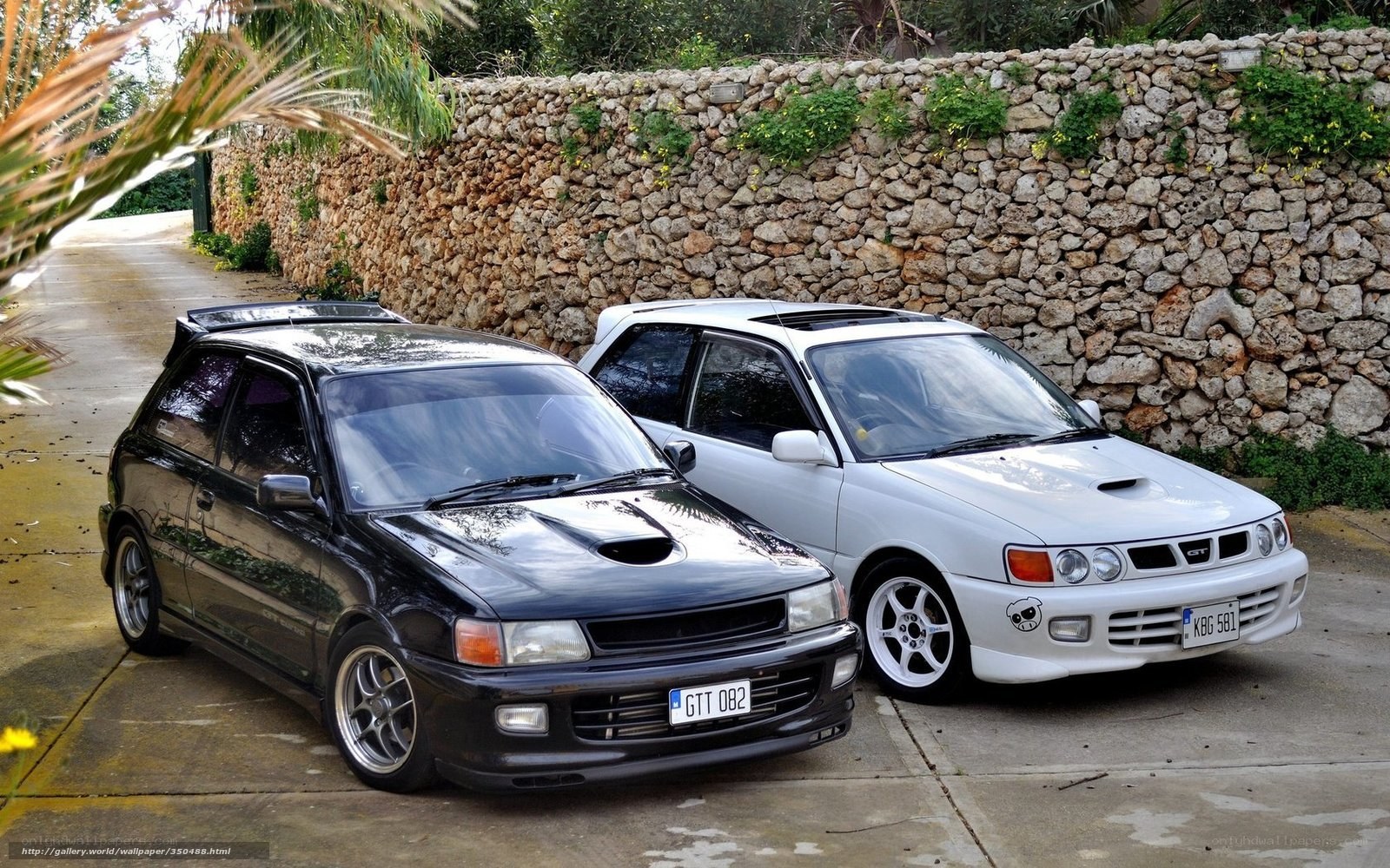 Two modified cars parked