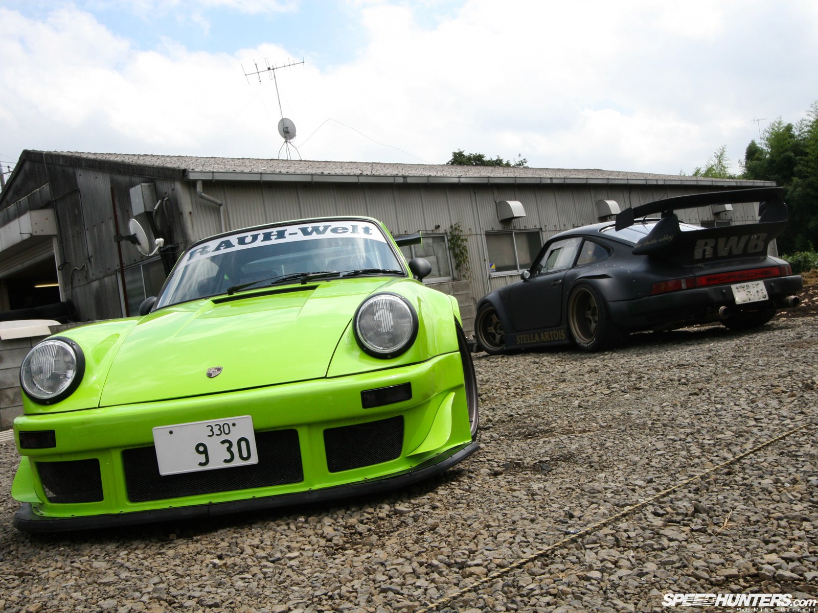 Two modified Porsches parked