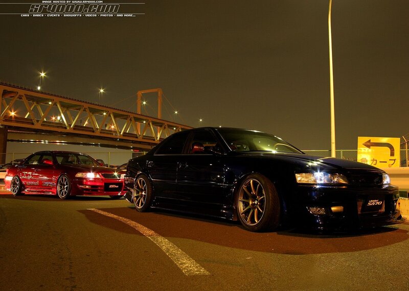 Two Modified Sedans at Night
