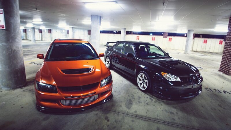 Two modified sports cars in garage