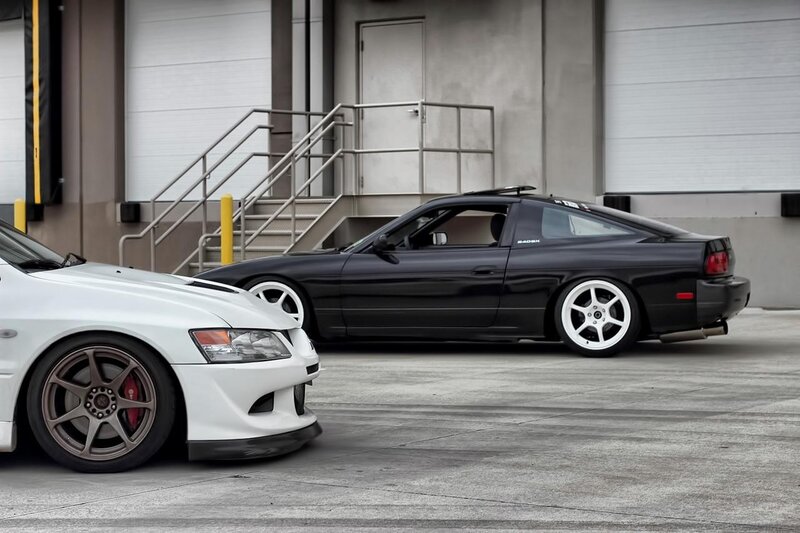 Two modified sports cars parked