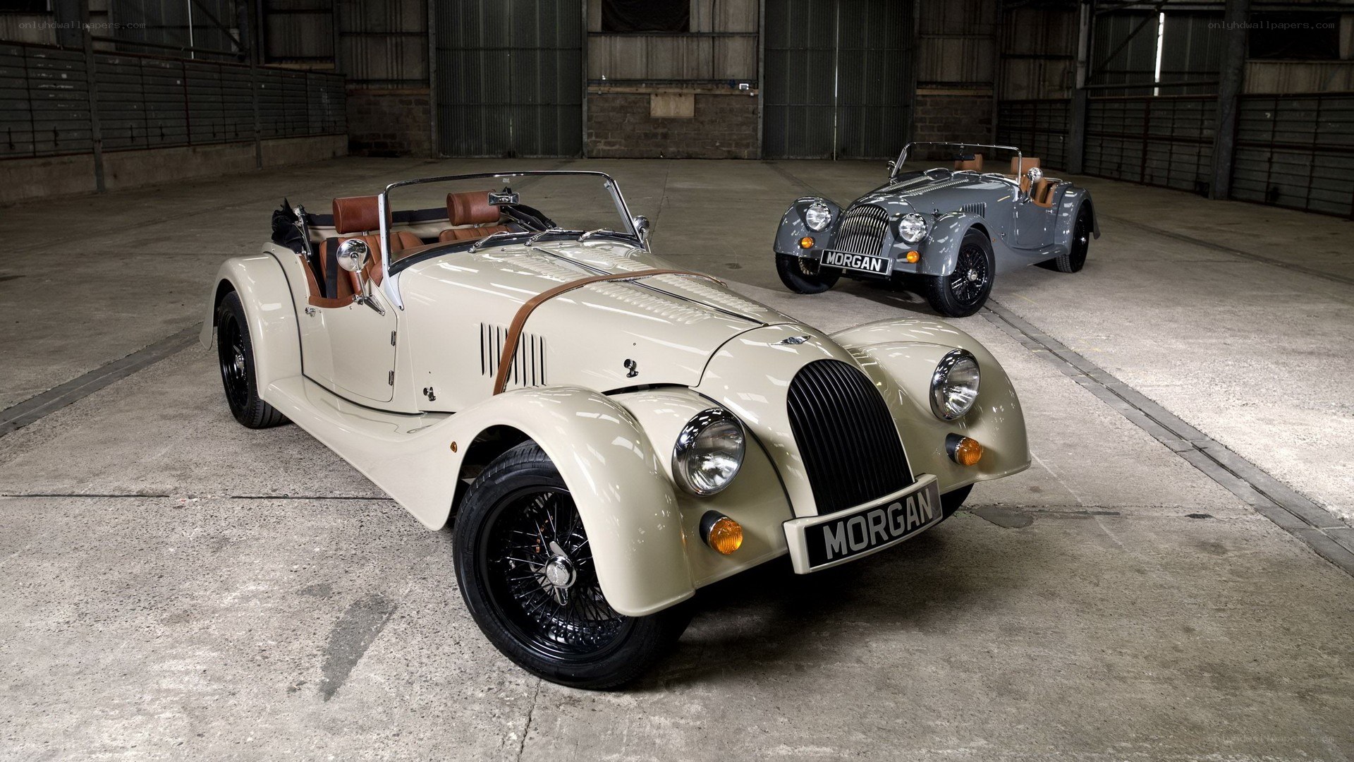 Two Morgan Roadsters in a Warehouse