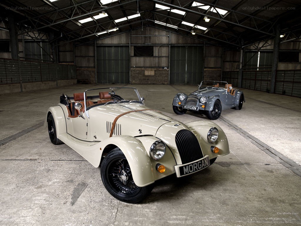 Two Morgan Roadsters in a Warehouse