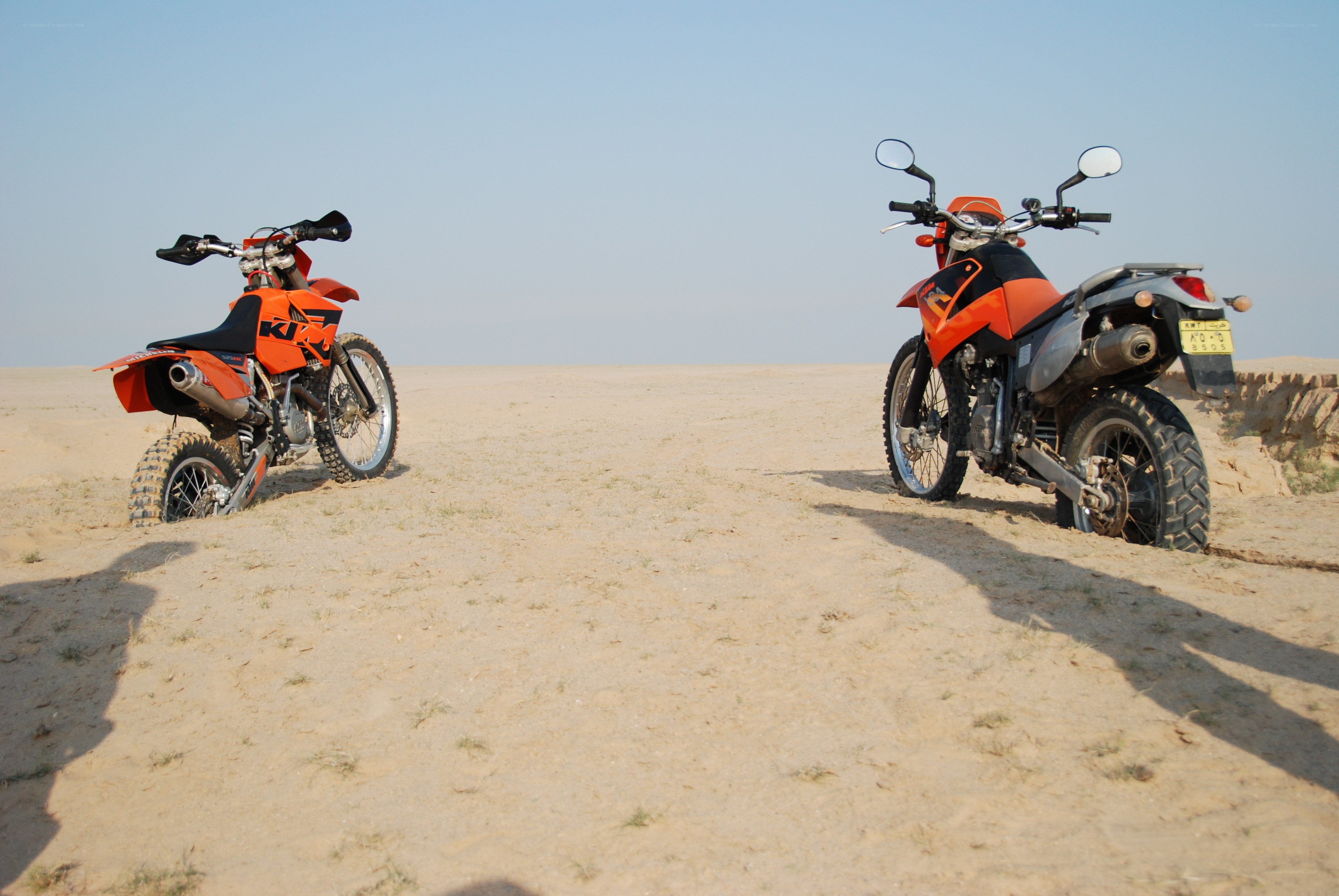 Two motorcycles in the desert
