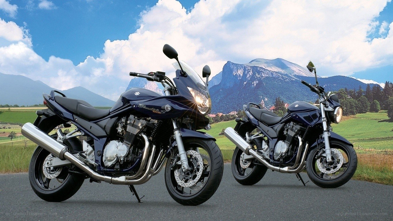 Two motorcycles on a scenic road