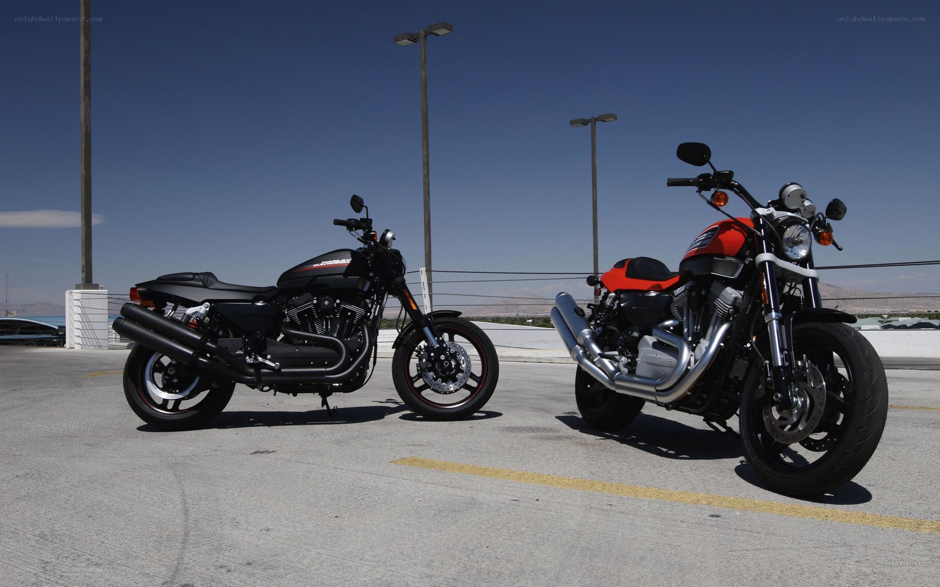 Two motorcycles parked in lot
