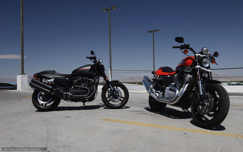 Two motorcycles parked in lot