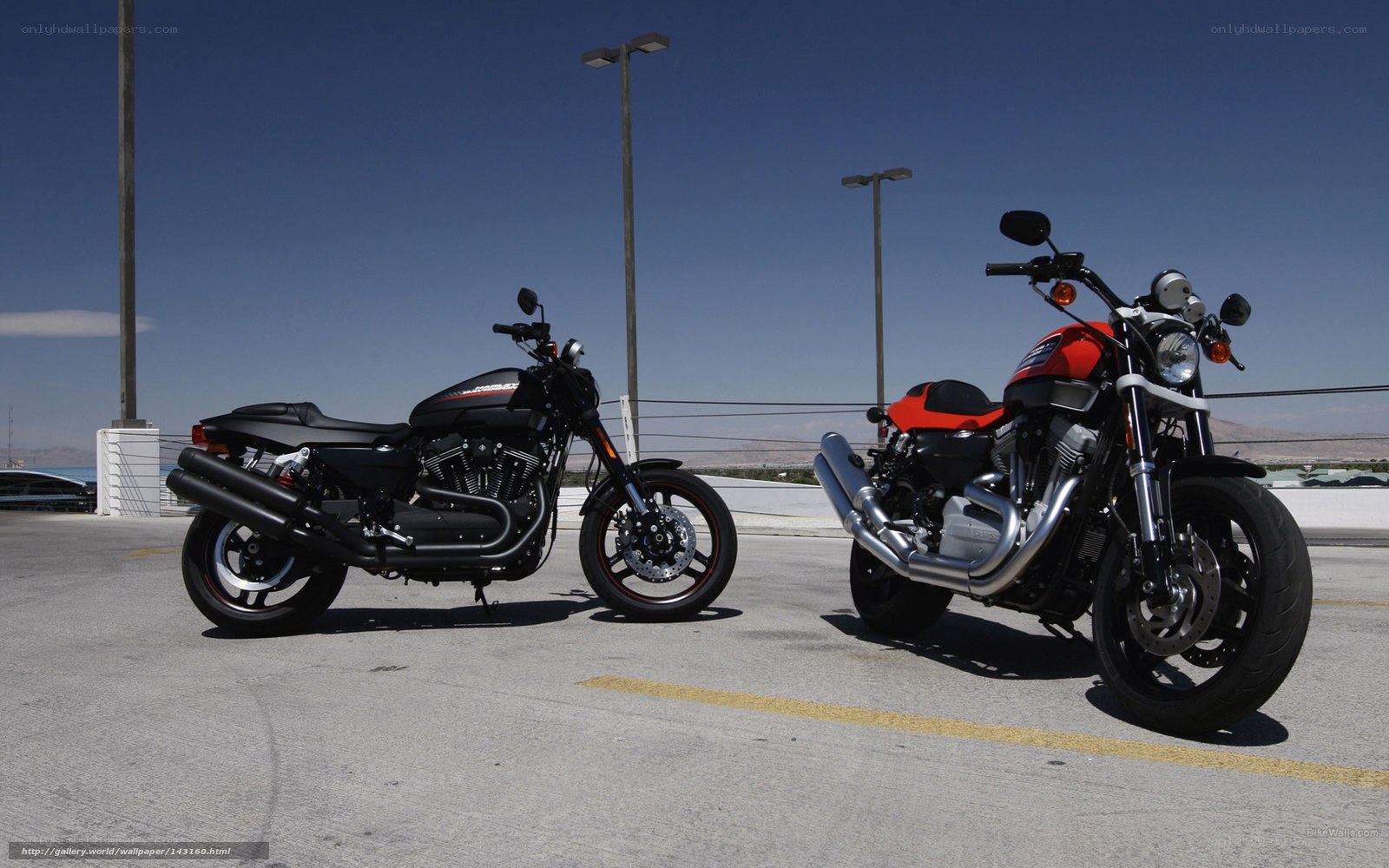Two motorcycles parked in lot