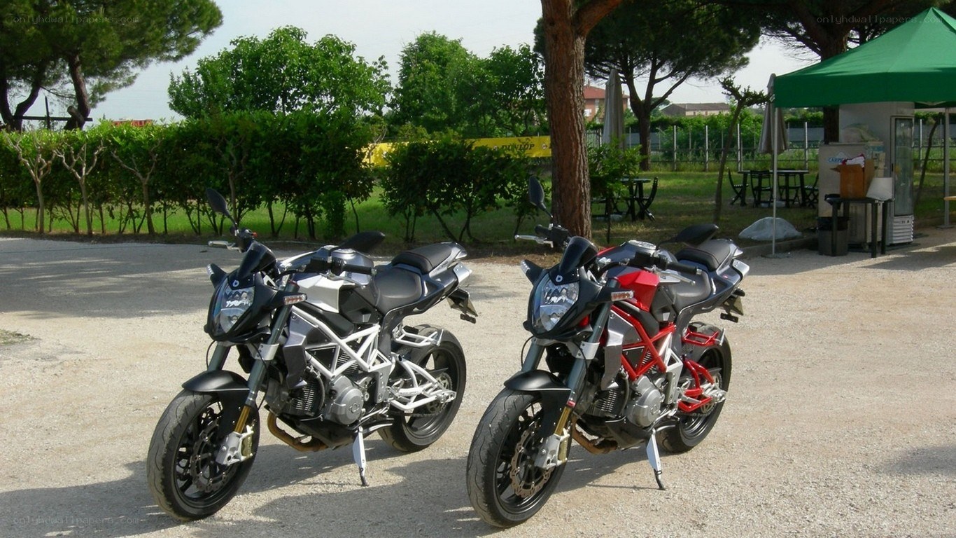 Two motorcycles parked outdoors
