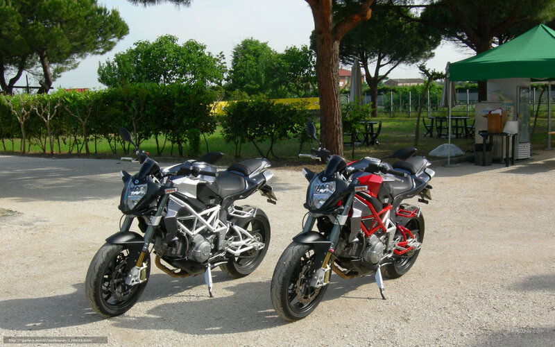 Two motorcycles parked outdoors