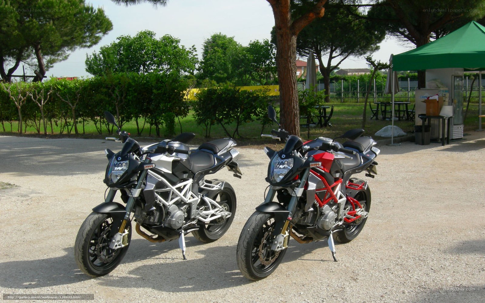 Two motorcycles parked outdoors