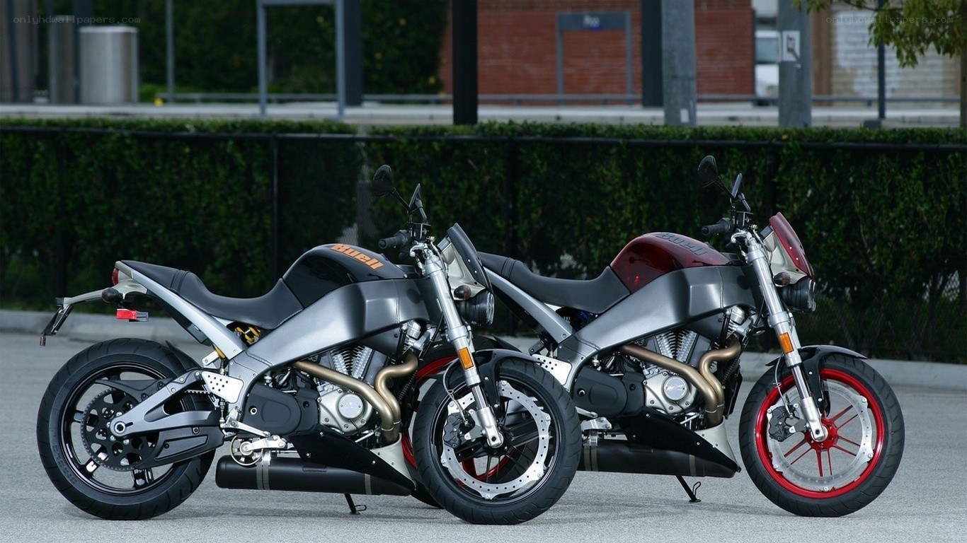 Two motorcycles parked side by side