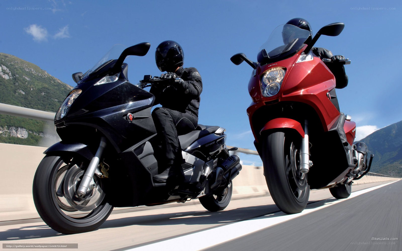 Two motorcyclists on a highway