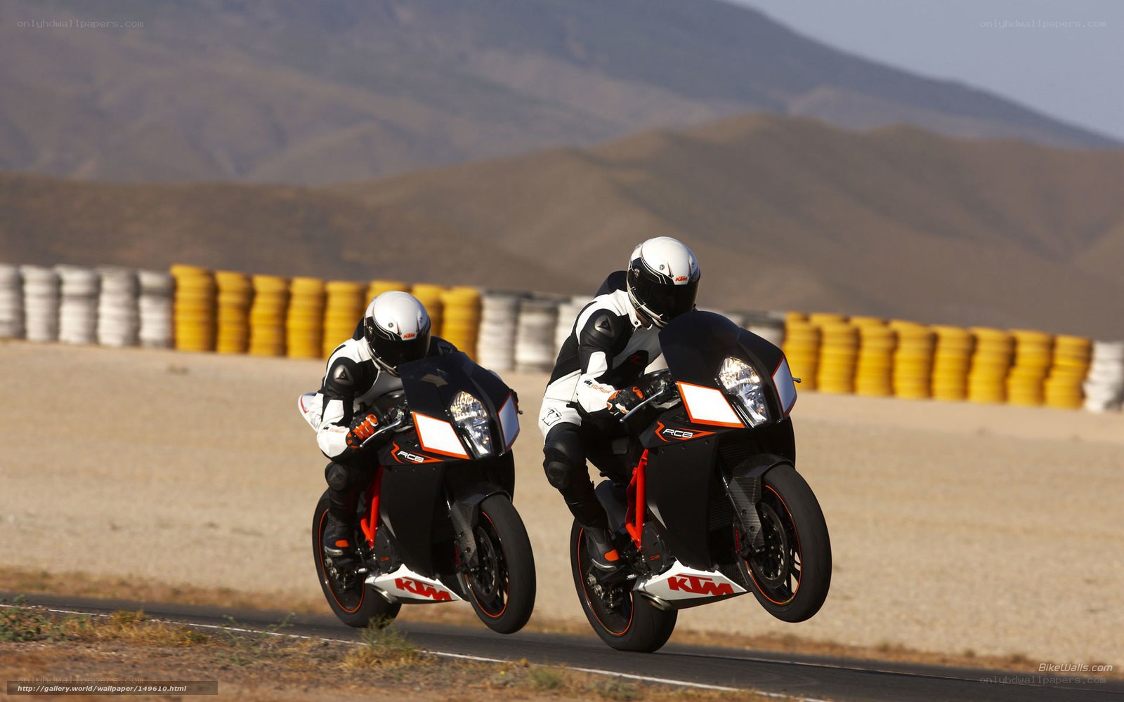 Two motorcyclists on a racetrack