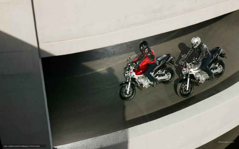 Two motorcyclists on a ramp