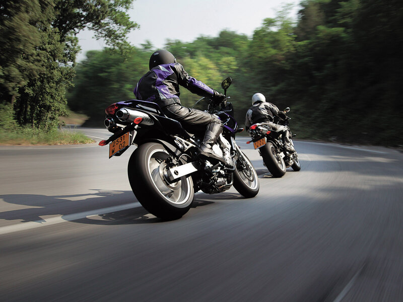 Two motorcyclists on a road