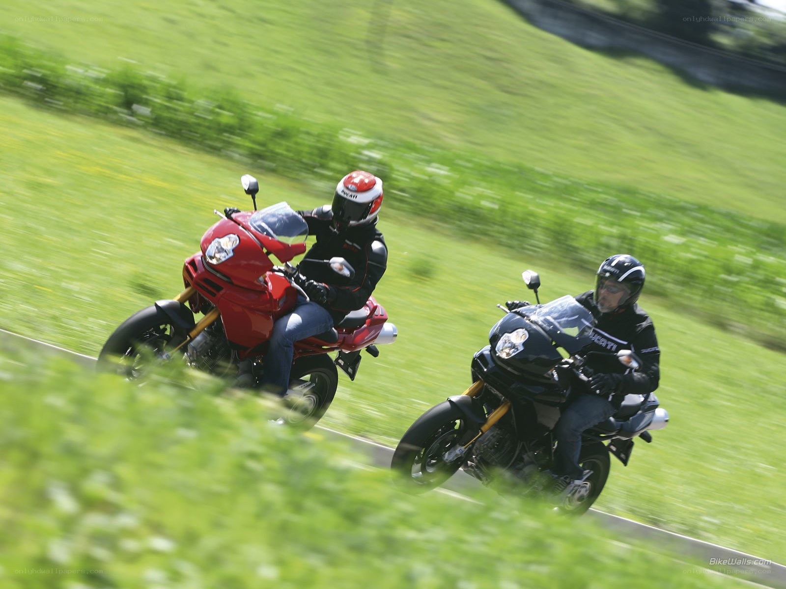 Two motorcyclists on a road