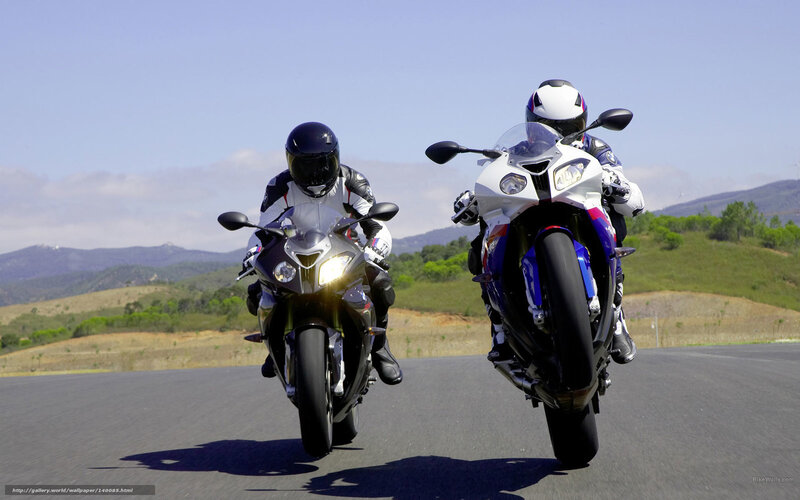 Two motorcyclists on a road