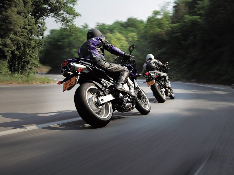 Two motorcyclists on a winding road