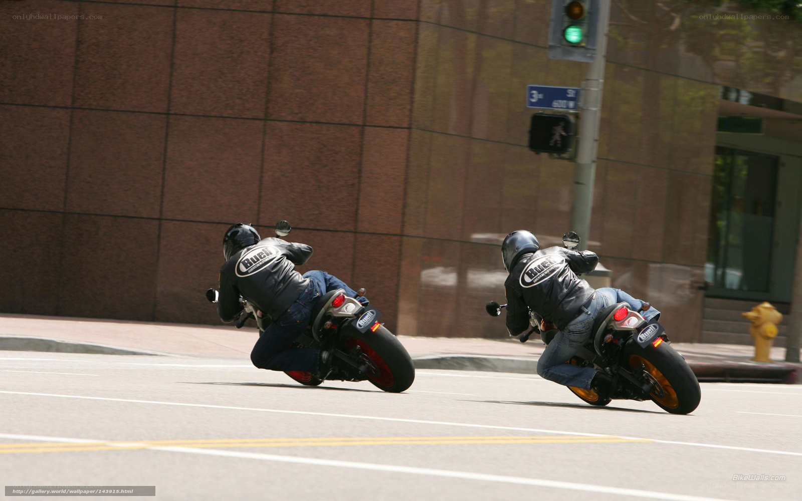 Two motorcyclists on city street