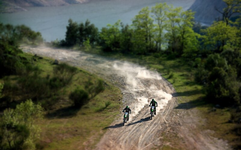 Two Motorcyclists on Dirt Path