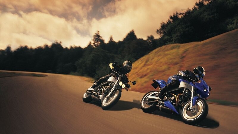 Two Motorcyclists on Road — Blue, Dynamic, Sunset