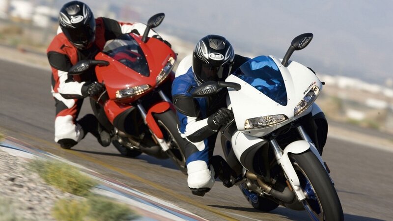 Two Motorcyclists on Track — Red, Dynamic