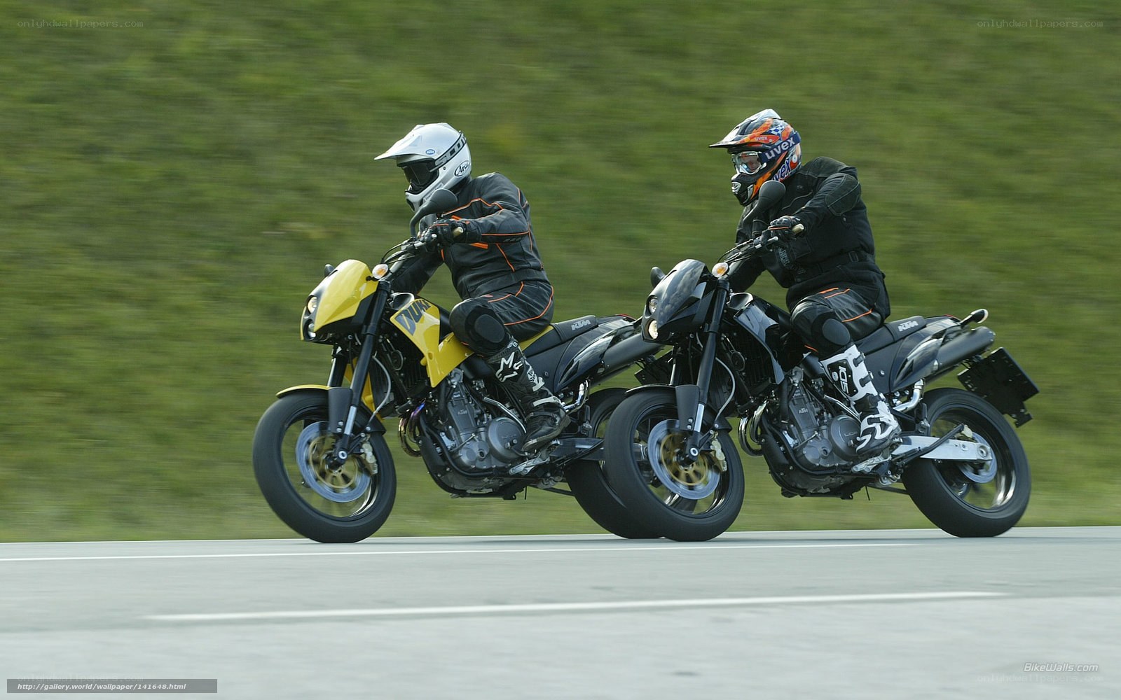 Two motorcyclists racing on a track