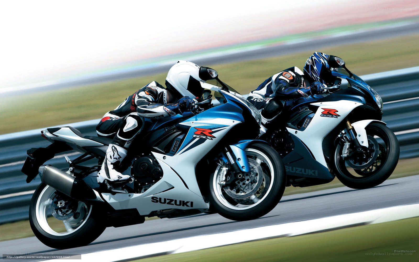 Two motorcyclists racing on a track