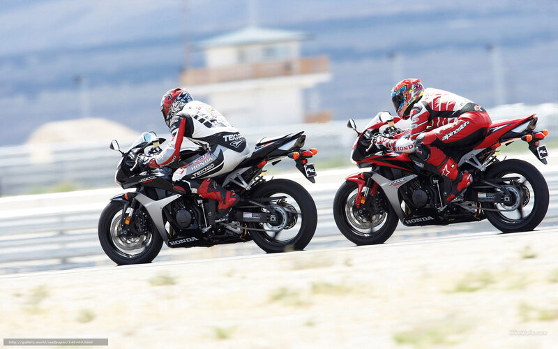 Two Motorcyclists Racing — Red