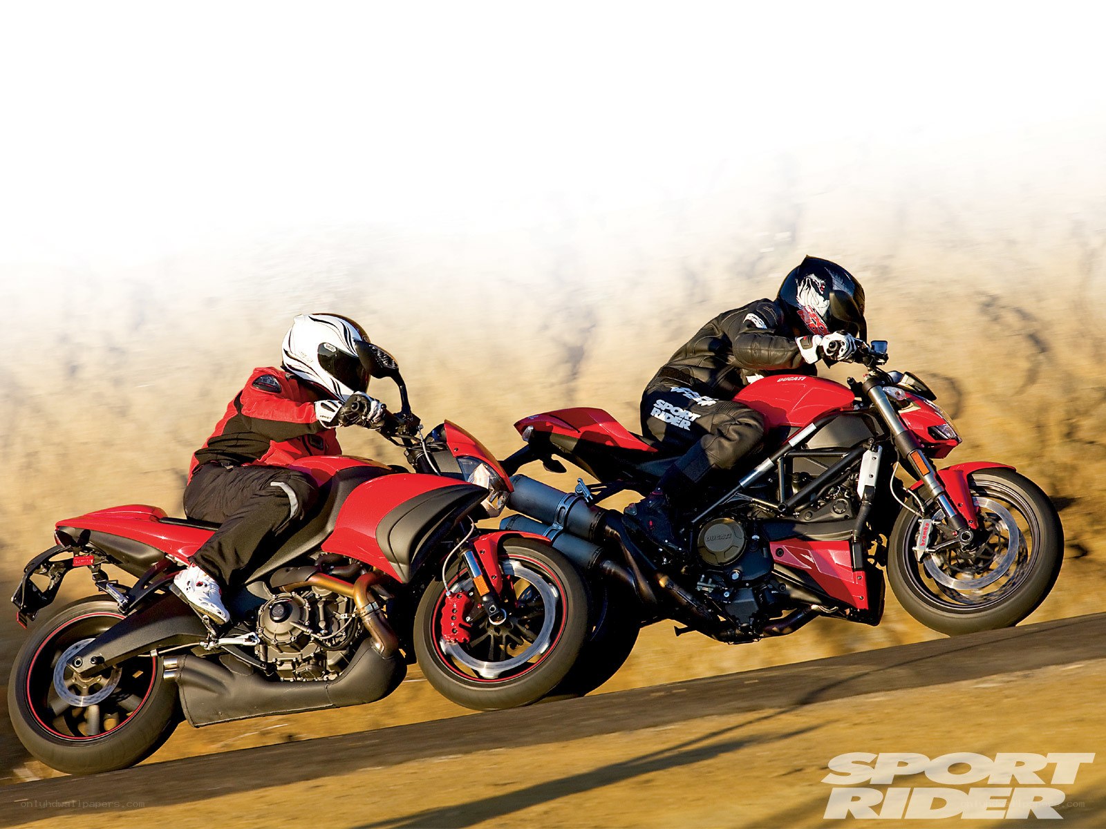 Two motorcyclists racing
