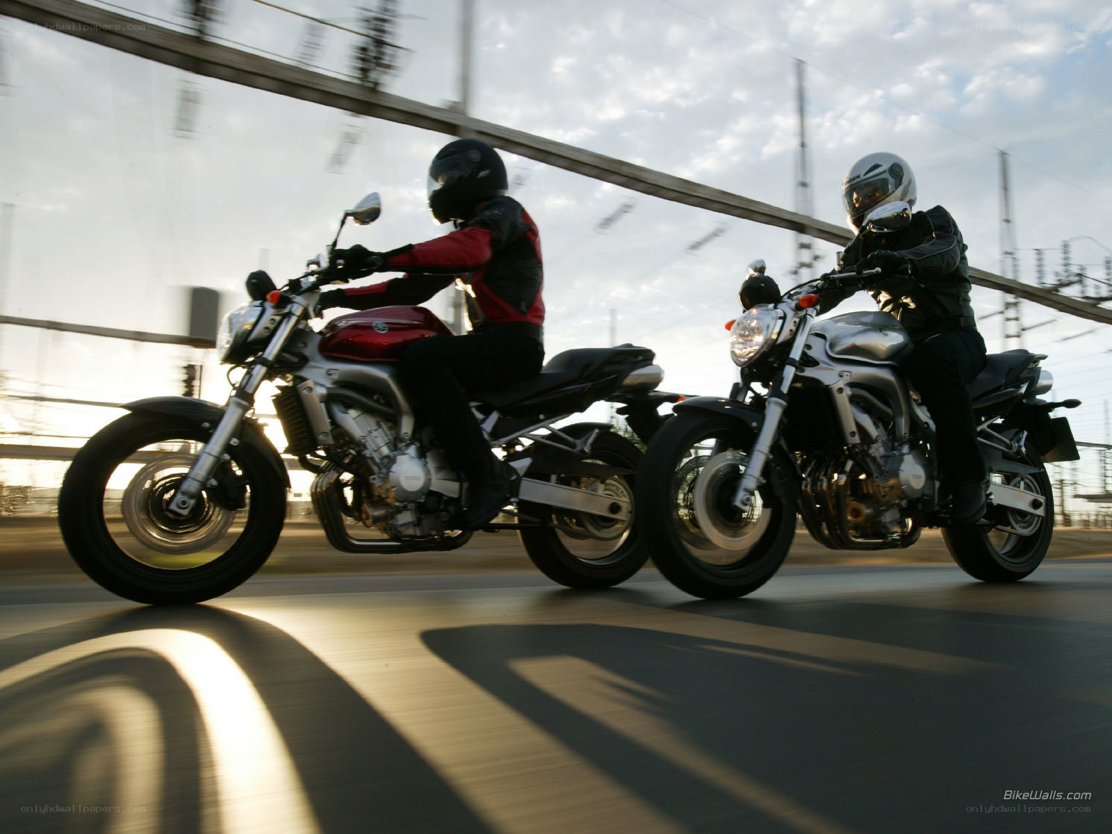 Two motorcyclists riding side by side