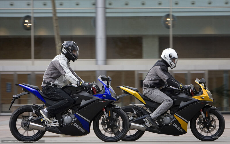 Two motorcyclists riding side by side