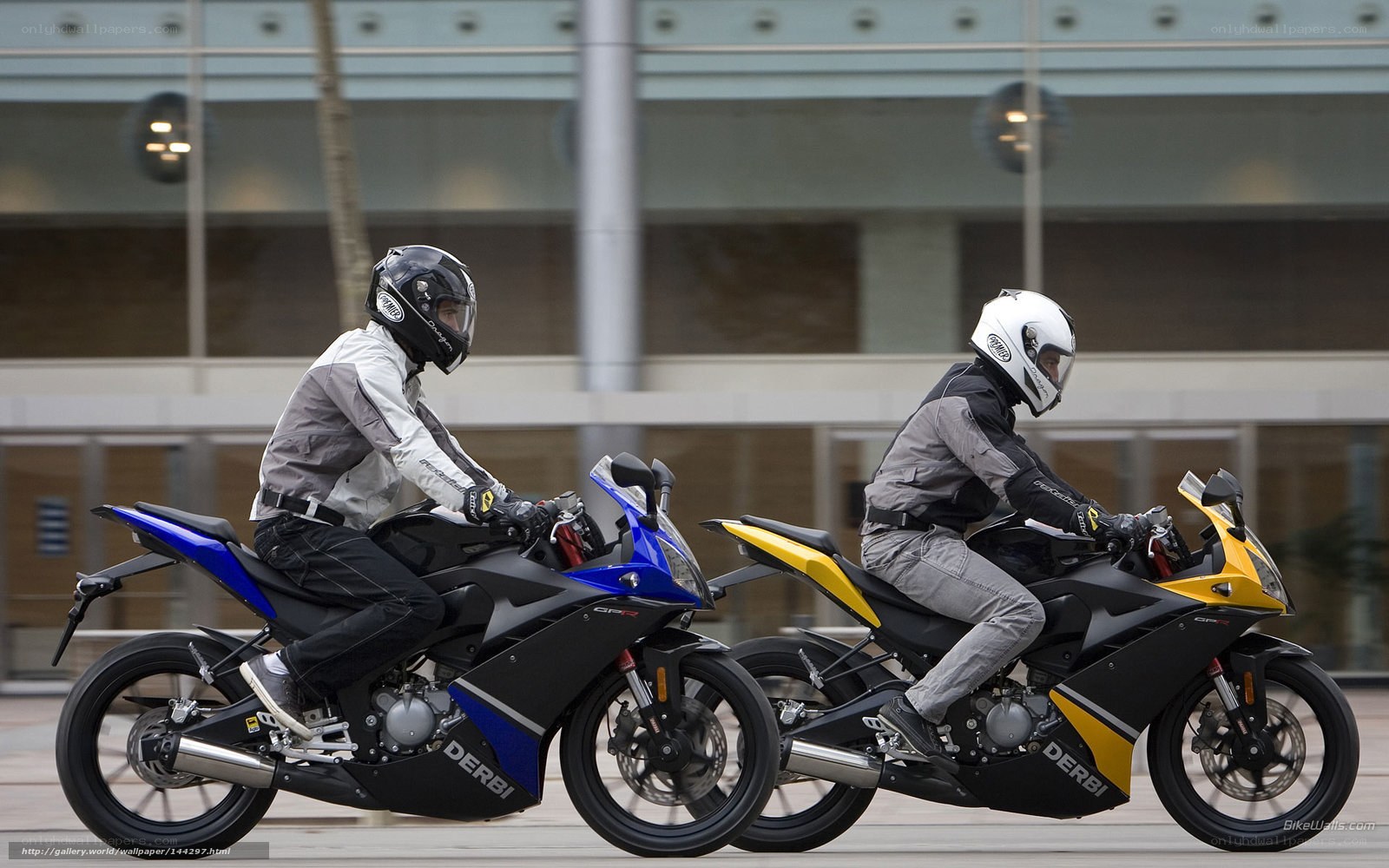 Two motorcyclists riding side by side
